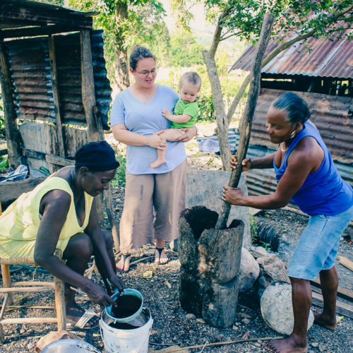Alix Davis and youngest son Elias watchin Haitian women grind coffee -web Alix Davis and youngest son Elias watchin Haitian women grind coffee -web